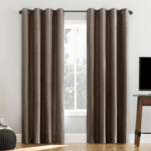 Brown blackout curtains with grommet top, framing a window view