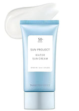Light blue sunscreen tube with white label, shown with a white cream smear