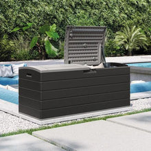 Large outdoor storage box with split lid open, dark gray plastic, hinged panels.