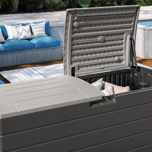 Large deck storage box with lid open, showing slatted interior panels and hinges.
