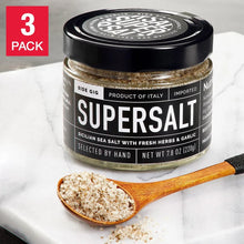 SuperSalt sea salt blend jar with herbs and garlic, black lid, wood spoon