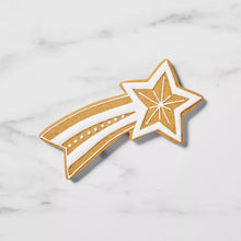 Falling star cookie with outlined star and ribbon detail