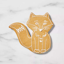 Fox-shaped sugar cookie with white icing lines and outlines