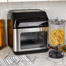 Multi-function air fryer with open cooking chamber and black top controls, stainless body.