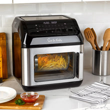 Multi-function air fryer front with digital panel and mesh window showing golden fries.