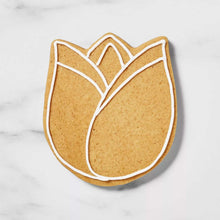 Tulip-shaped baked cookie with white icing outline