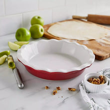 Red ceramic pie dish with fluted rim, filled with pie crust, 9.5-inch