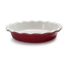 Red ceramic pie dish with scalloped edges and wavy rim, 9.5-inch size