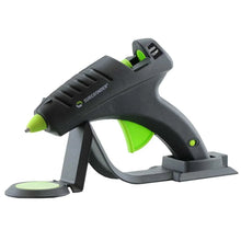 High-temperature hot melt glue gun with black body and green trigger, on base