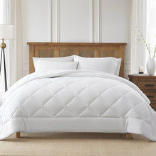 White cooling comforter with diamond-quilted top and corner drape