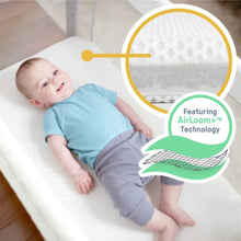 Baby resting in cream co-sleeping bassinet with breathable AirLoom+ mattress insert