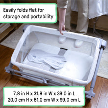 Cream co-sleeping bassinet folded flat for storage with mattress and mesh side panels