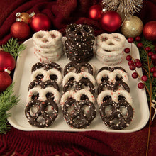 Assorted peppermint pretzels in a tray: dark and white glazed ring pretzels