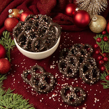 Dark peppermint pretzels in a bowl with sprinkled sugar coating