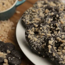 Dark chocolate pretzel cookie with chopped cookie pieces coating, close-up