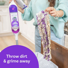 Swiffer PowerMop refill mop pad held with cleaning solution bottle on countertop