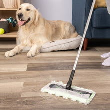 Swiffer dry sweeping cloth refill on a floor sweeper head during home cleaning