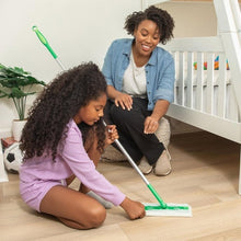 Swiffer dry sweeping cloth refill on a floor sweeper for cleaning floors