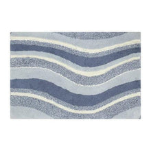 Swirl bath rug rectangle design with layered navy, gray, and cream stripes