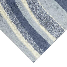 Swirl bath rug close-up of textured light gray and navy wavy stripes