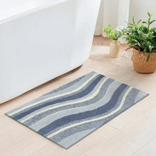 Swirl bath rug with navy and light gray curved stripe pattern