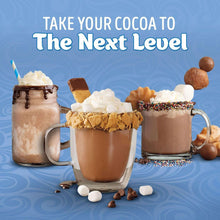 Hot cocoa mugs with whipped topping and chocolate pieces