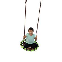 Child sitting in green-and-black striped tree swing saucer with brown padded seat
