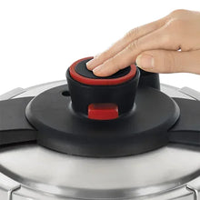 Pressure cooker lid control with red button and black steam vent cover