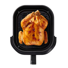 T-fal air fryer interior with whole roasted chicken in removable basket