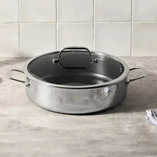 Stainless steel universal pan with side handles and glass lid