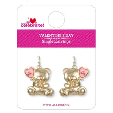 Pair of gold teddy bear single earrings with pink heart details on display card