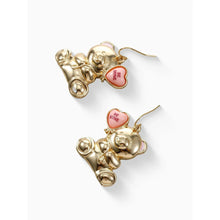 Teddy bear drop earrings in gold with pink heart charms, angled view