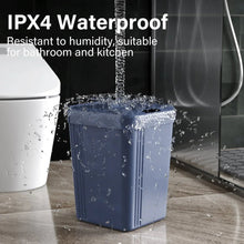 Blue waterproof smart trash can with water spray splashing over the lid