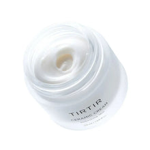 TIRTIR Ceramic Cream texture in jar opening, swirl of white cream.