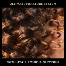 Curly hair close-up with hyaluronic and glycerin text overlay