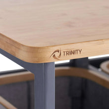 Bamboo tabletop corner with TRINITY logo on a laundry station