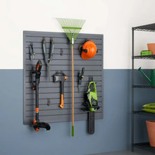 Gray slatwall accessory set with multiple tool holders and hooks, holding yard and power tools