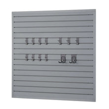 Gray slatwall board with row of metal hooks and accessory holders