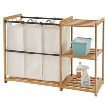 TRINITY bamboo laundry station with hanging white hamper bags and side shelf storage
