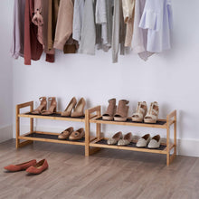 Two bamboo shoe racks with three open shelves each, holding pairs of shoes