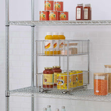 Two-tier wire storage drawer with metal slides, holding jars and pantry items