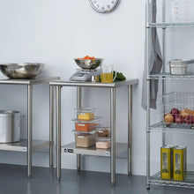 Stainless steel storage table with open lower shelf and containers on two levels