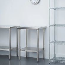 Stainless steel table showing underside lower shelf frame and four sturdy legs