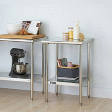 Stainless steel table with open lower shelf and smooth worktop for kitchen prep
