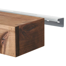 Walnut floating shelf corner with metal mounting bracket attachment.
