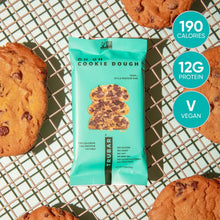 TRUBAR Oh Oh Cookie Dough protein bar pouch on wire rack with cookie pieces.