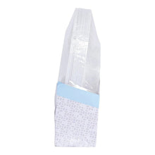 Stacked round white disposable plastic plates, upright in a protective packaging sleeve