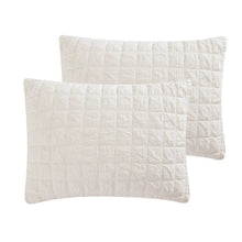 White cotton pillow shams with quilted, crinkle-style stitched texture