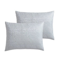 Light grey jacquard pillow shams with textured pattern