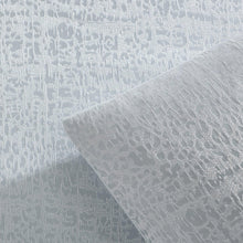 Light grey jacquard fabric with repeating leaf-like texture